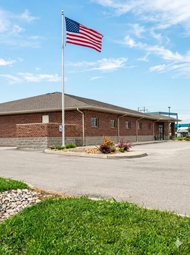 business store front, brick building, parking lot