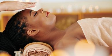 Woman receiving a relaxing facial treatment in a spa.