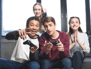 Group of teens playing video games.