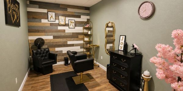 Cozy, stylish hair salon with modern decor and warm wooden accents.