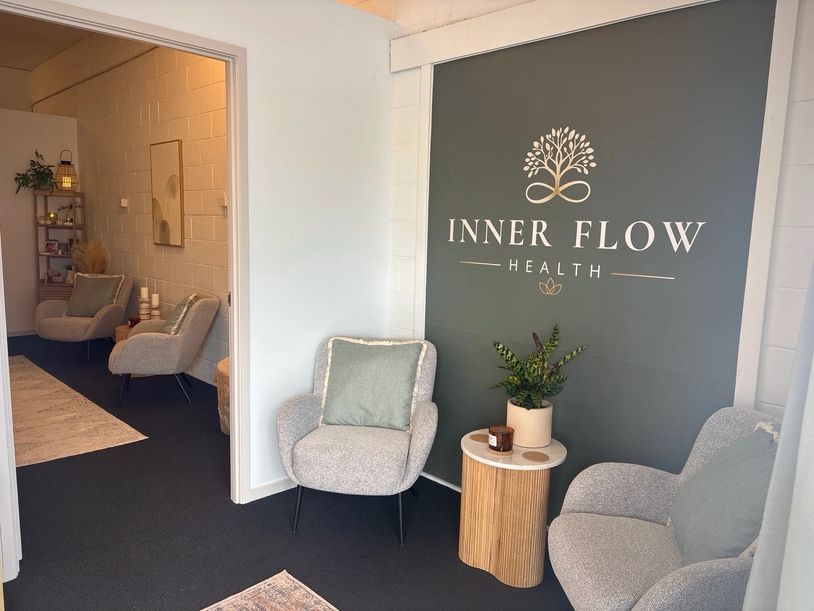 Cozy waiting area at Inner Flow Health with comfortable chairs.