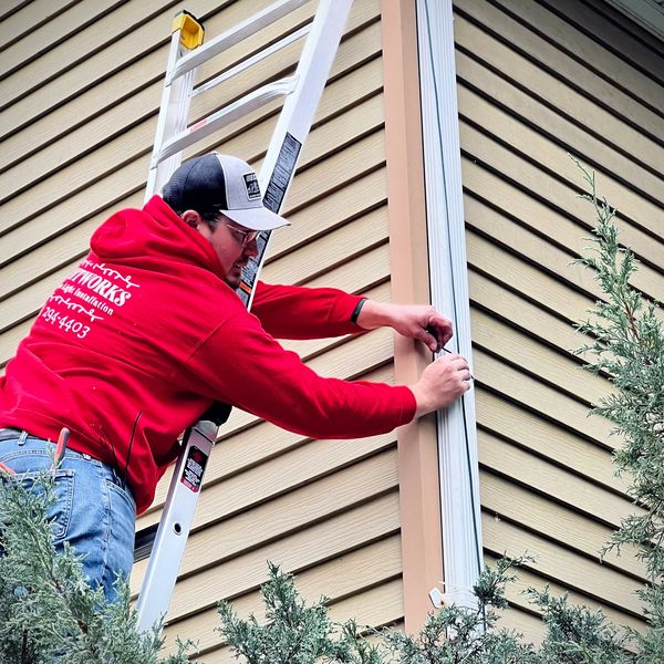 Installing Christmas Lights with a ladder