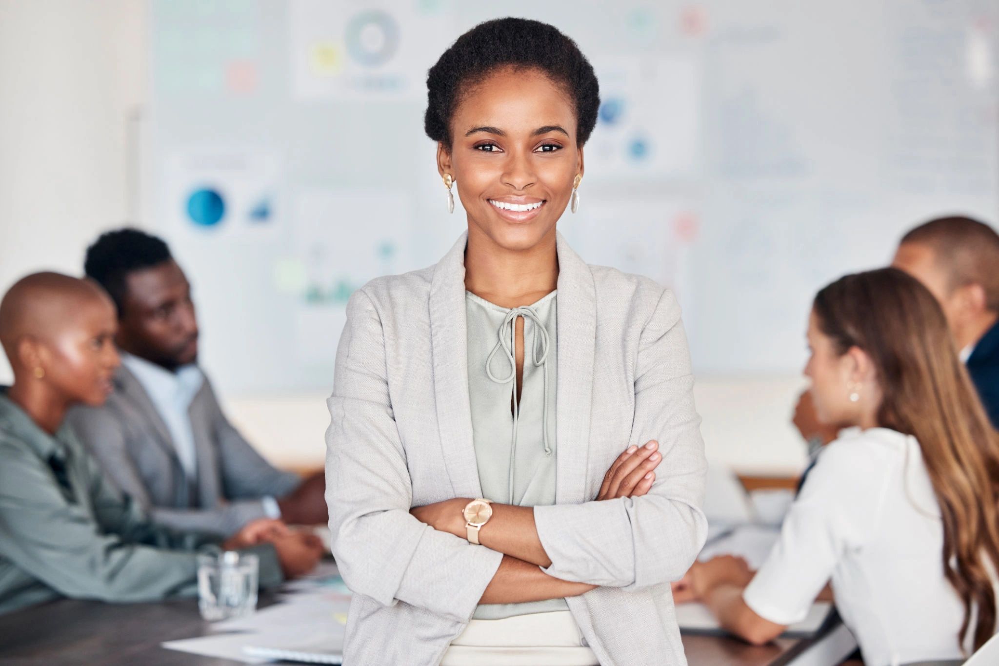 Meeting, team and portrait of black woman, leader or manager standing with pride, confidence. 