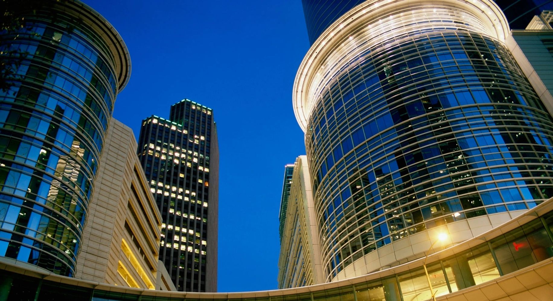 Various fresh vegetables wrapped in plastic on trays.