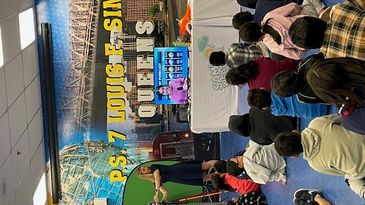 Students watch a weather forecast presentation at P.S. 7 Louis F. Simeone in Queens.