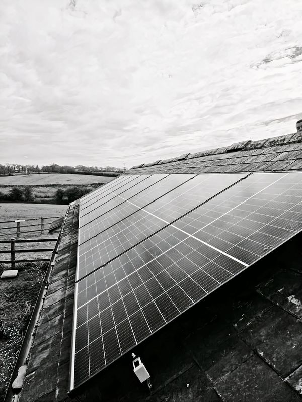 Modern solar panels on a house roof in Redruth, West Cornwall by DT Electrical Contractor