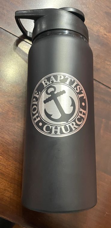 A water bottle that was designed and engraved for a client