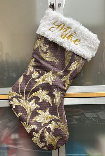 A stocking that was designed, sewn and embroidered for a client