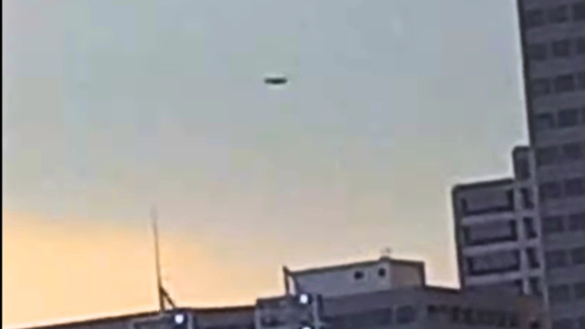 Cincinnati Ohio UFO Hovering With Helicopter Off Near City Bridge