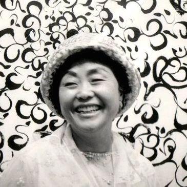 Artist Heesung Lee in front of her painting 