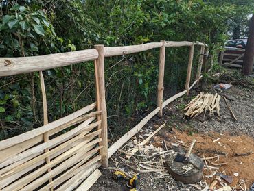 Woven fence under construction