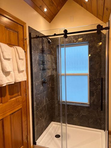  New Attic bathroom build with vinyl tiles and glass shower enclosure.