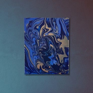 Abstract acrylic pour in royal blue and gold, evoking a dreamy, regal nursery.