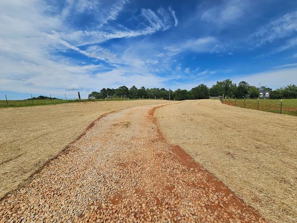 GRADE,DEROCK,EROSION MAT,SEED AND FERTILIZE