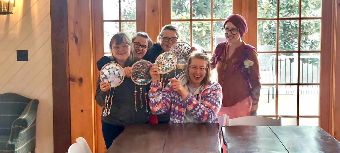 Friends in Faith Art class event attendees displaying their colorful creations!
