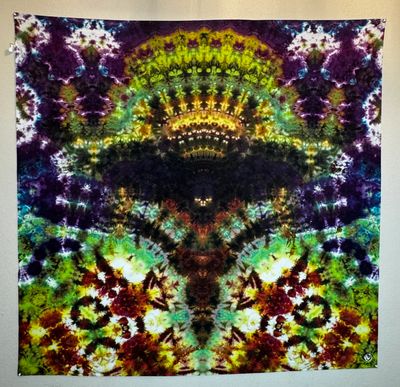 Colorful symmetrical tie-dye pattern with vivid colors.