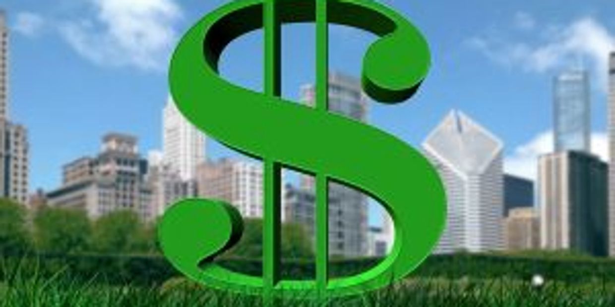 Large green dollar sign in a city park with skyscrapers in the background.