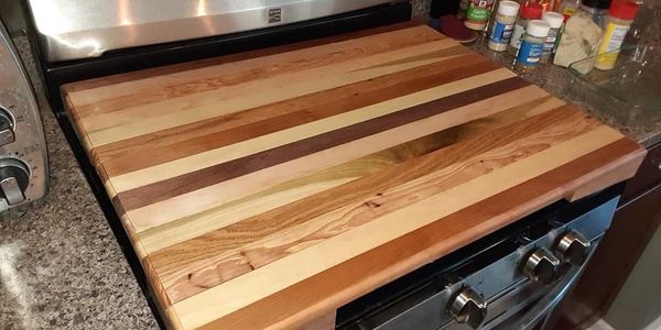 Stove Top Cutting Board Made with Oak, Hickory, Aspen, Poplar, Mahogany, and Maple.  $250.00 