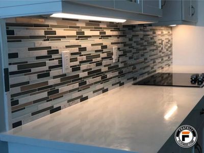 The image shows a kitchen backsplash installed by Fratelli Flooring contractor in Palm City, FL.