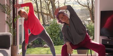 Two people doing yoga