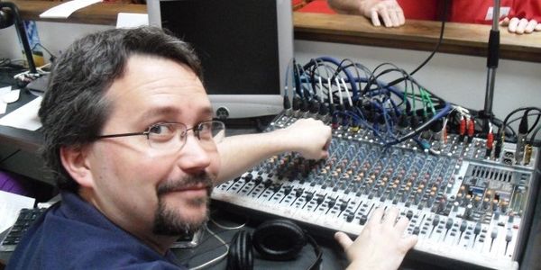 Man working at music sound board