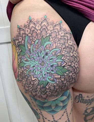 chrysanthemum flower mandala butt tattoo 
