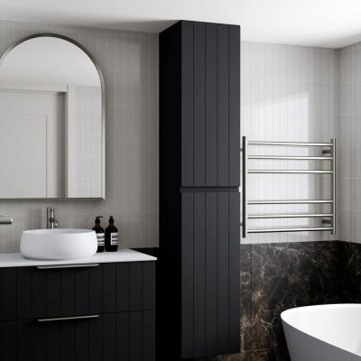 Modern bathroom with black cabinetry and white vessel sink.