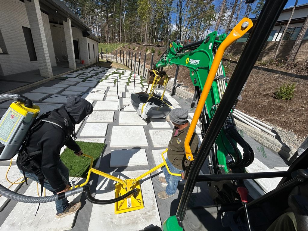 Installation of custom pavers.  