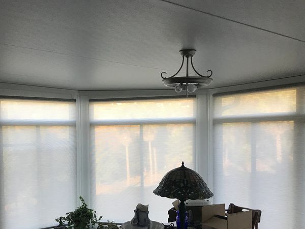 Solar Shades in a Sunroom.  White will cause lots of glare..