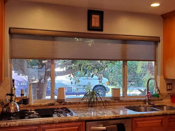 Motorized Roller Shade Over Kitchen sink.  Fabric wrapped Fascia.