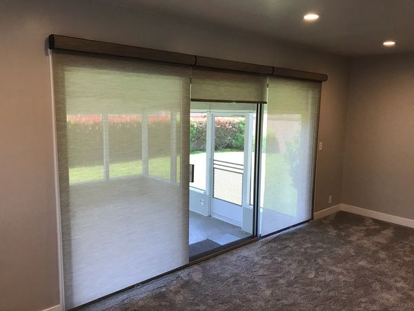 Cordless Roller Shades on a mid split slider.  Fabric wrapped fascias.