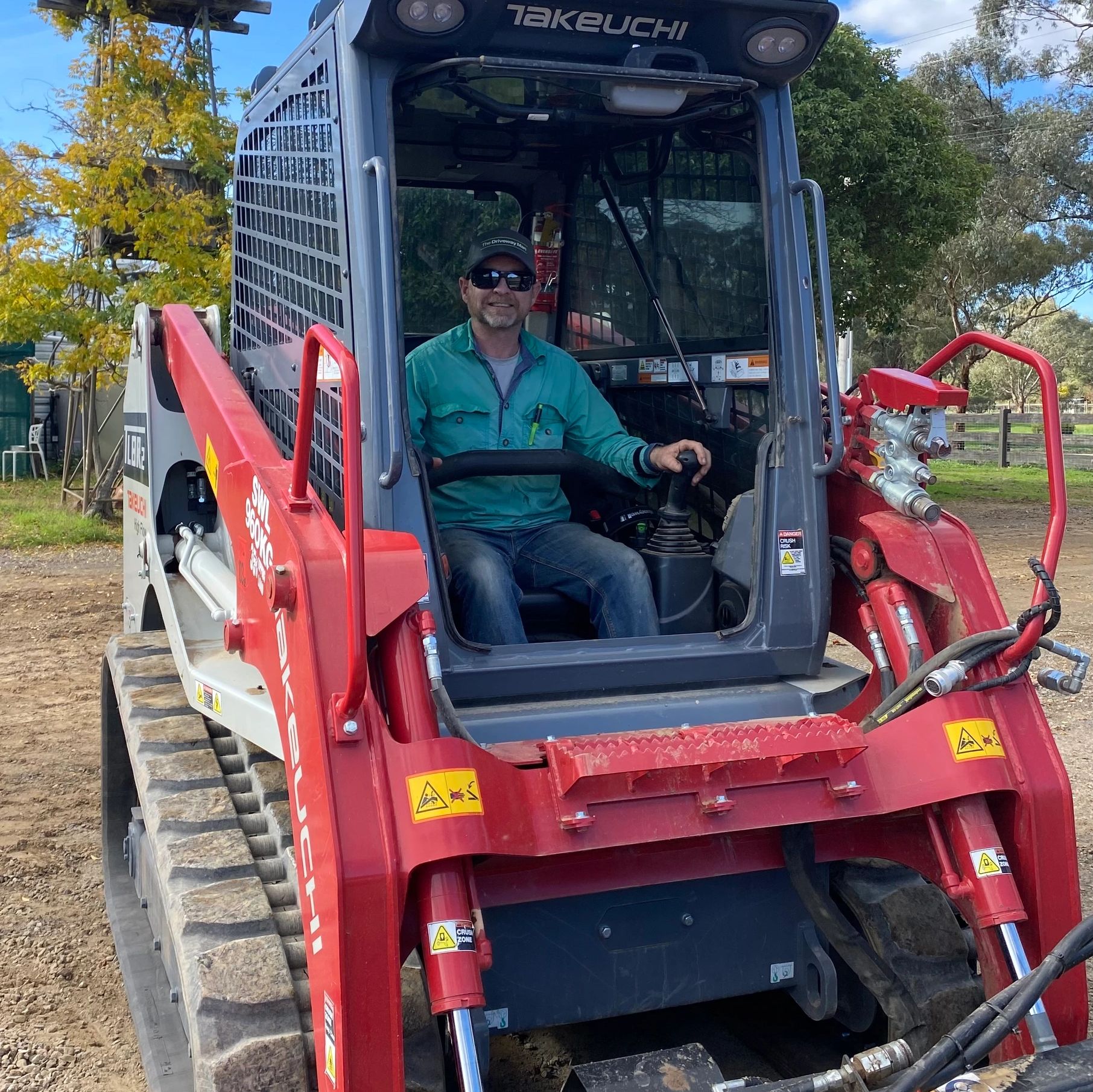 Tony sitting in his red skid