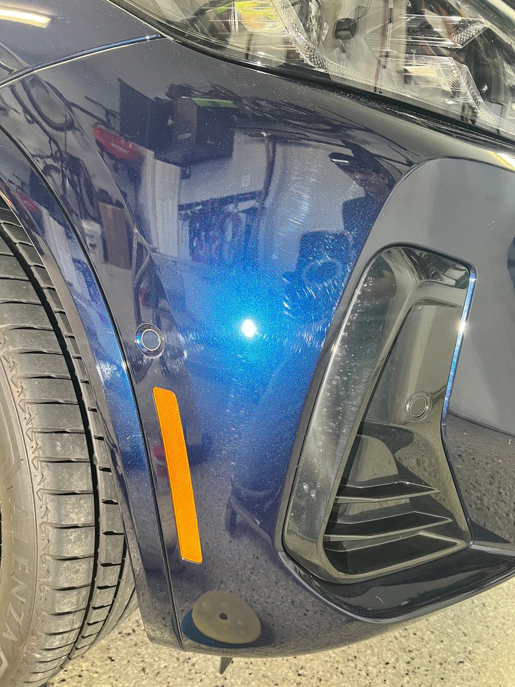 BMW fender with more swilr marks.