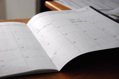 Open planner book with calendar days
