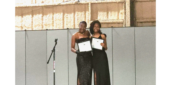 The two title holders of the 1st annual Belle of the Ball Beauty Pageant!
