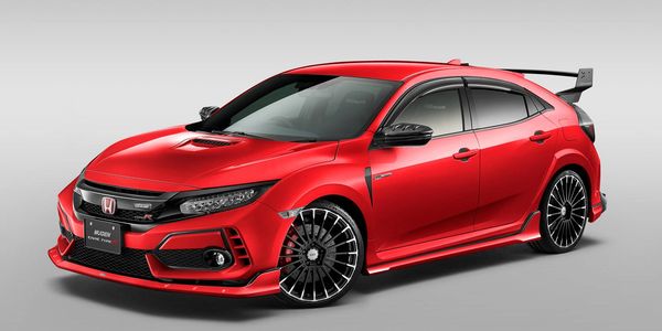 Red Honda Civic Type R with sporty Mugen modifications and black accents.