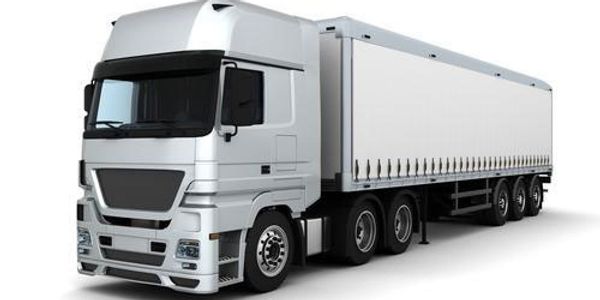 White semi-truck with a large trailer isolated on white background.