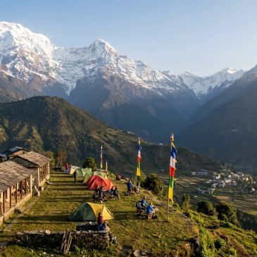 Mountain campsite with tents and prayer flags.