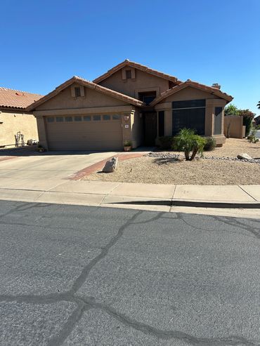 Single-story desert-style house with a two-car garage.