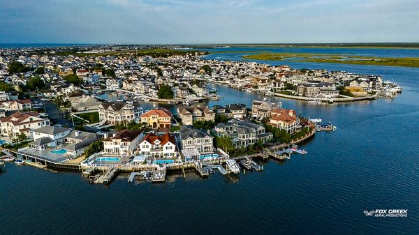 Drone photograph of vacation homes on the water in Ocean City, NJ by Fox Creek Aerial Productions.