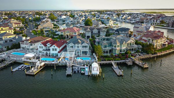 Aerial view of colorful waterfront vacation homes in Ocean City, NJ by Fox Creek Aerial Productions.