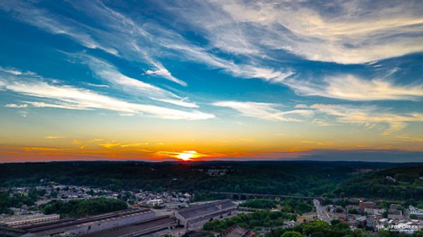 Aerial photo of a colorful sunset over Coatesville PA shot by Fox Creek Aerial Productions