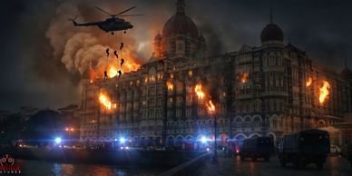 Helicopter drops water on a burning historic building at night.