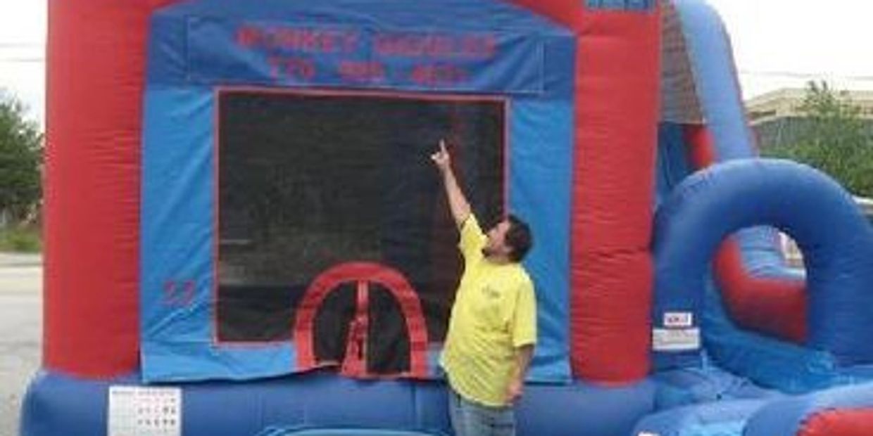 Red and blue bounce house combo with slide by Monkey Giggles party rentals in Gwinnett County