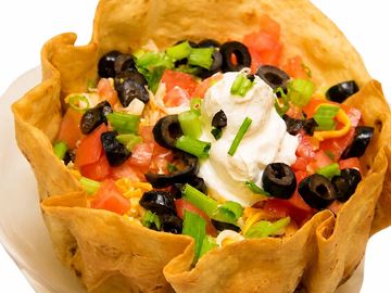 Taco salad in an edible tortilla bowl.