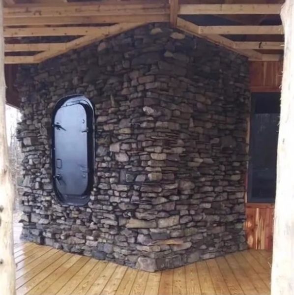 New construction chimney with a submarine door to load logs into the back of the fireplace