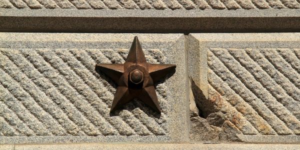 Bronze star marking the scars of war on SC Statehouse