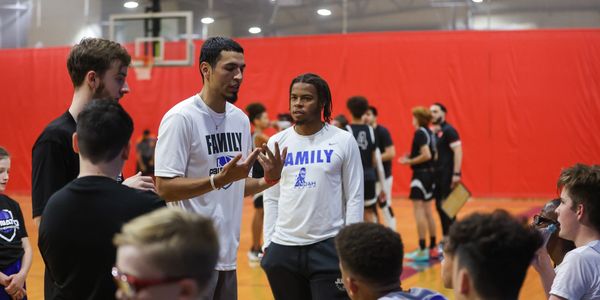 Basketball coach explaining and teaching during a timeout.
