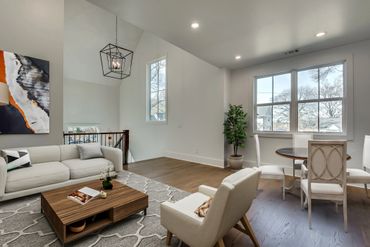 Modern living room with neutral tones and stylish furniture.