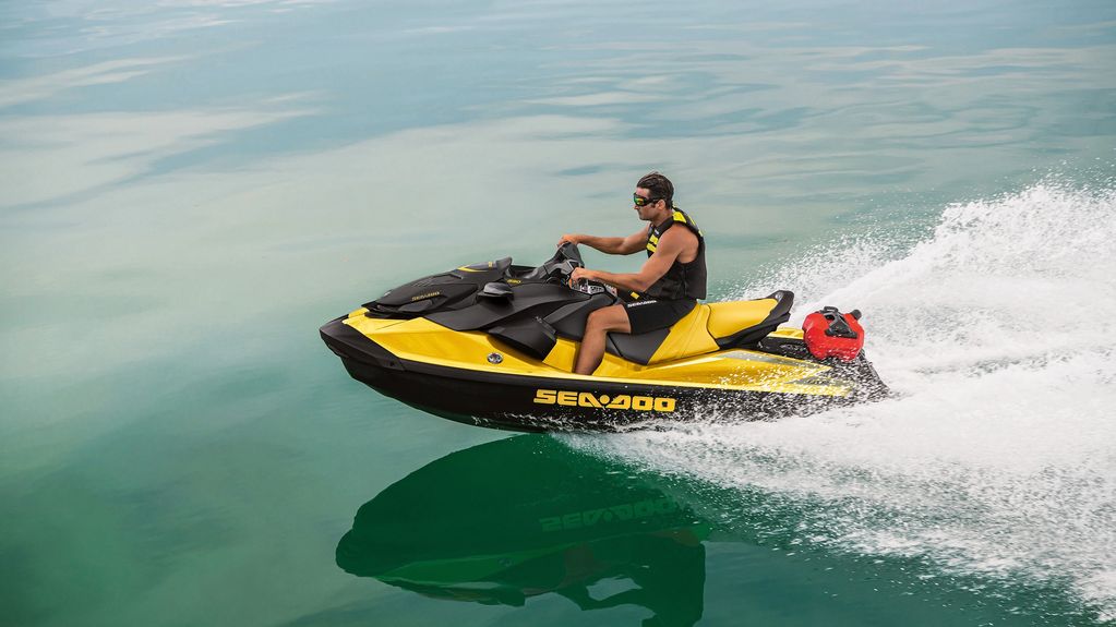 Yellow and black 2022 Sea-Doo GTR 230 riding on open water